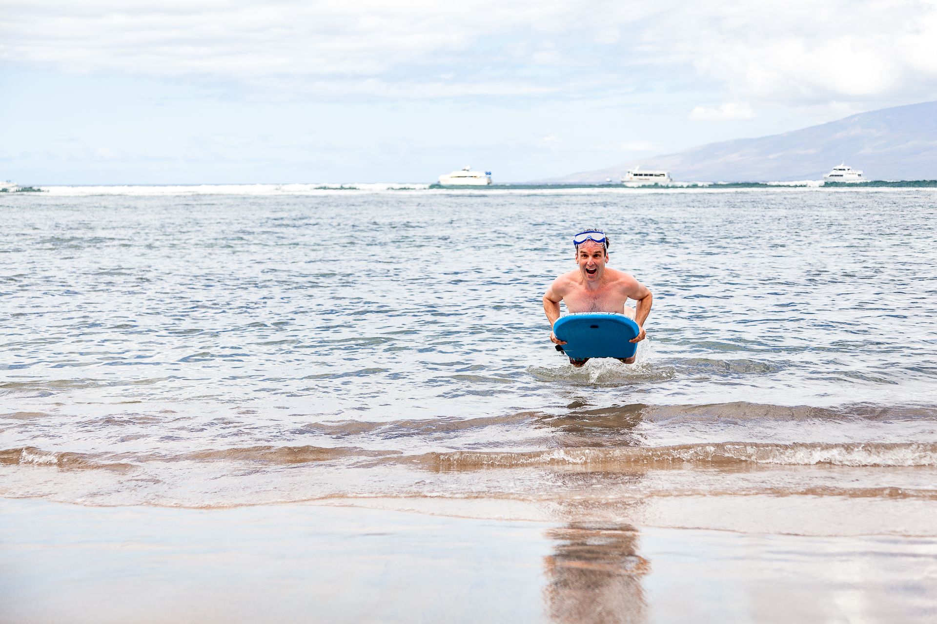 Excited Young Man Airborn on His Bodyboard at the Beach