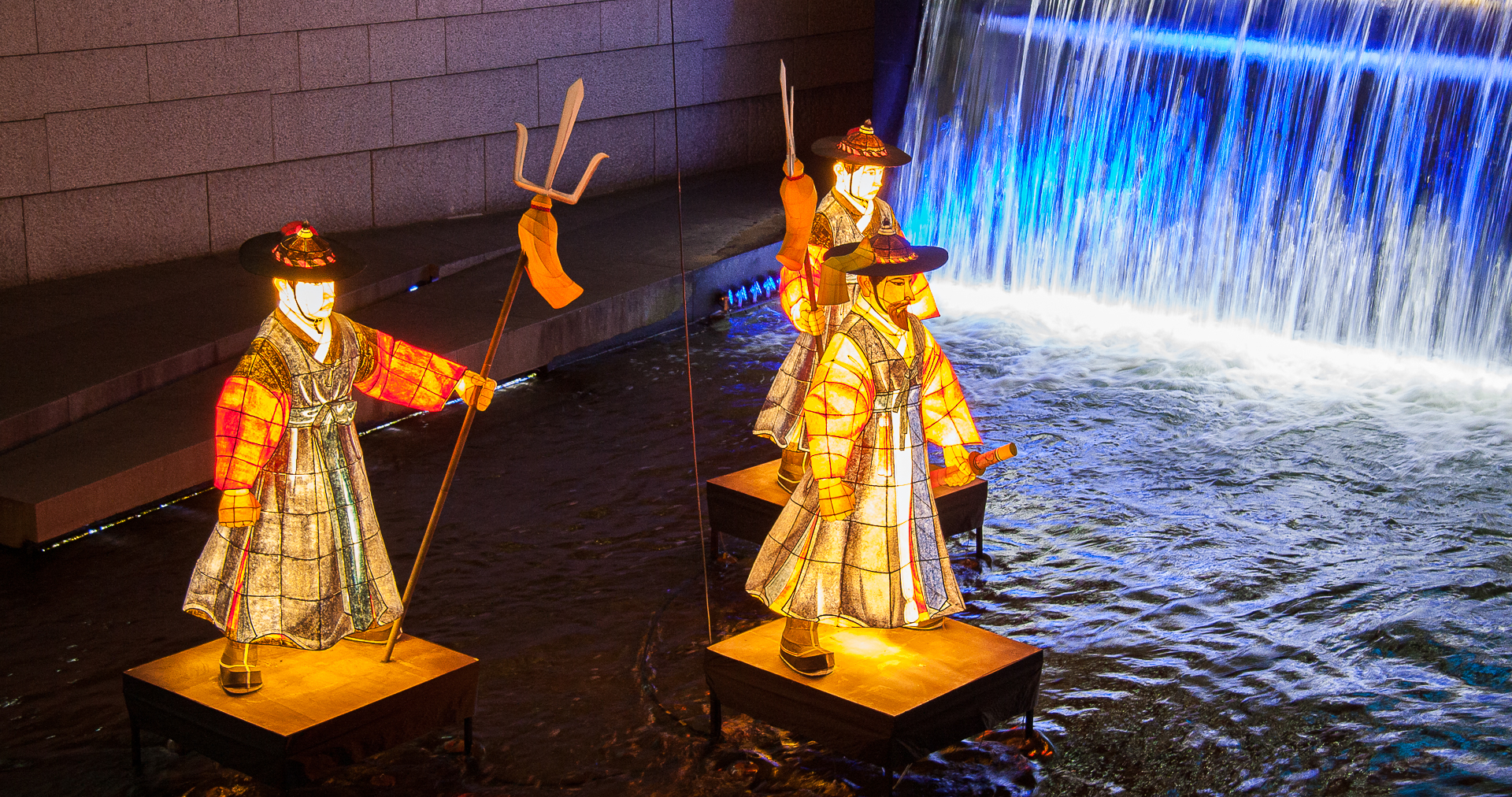 Three lanterns in Cheonggye Stream in Seoul, next to the waterfall.