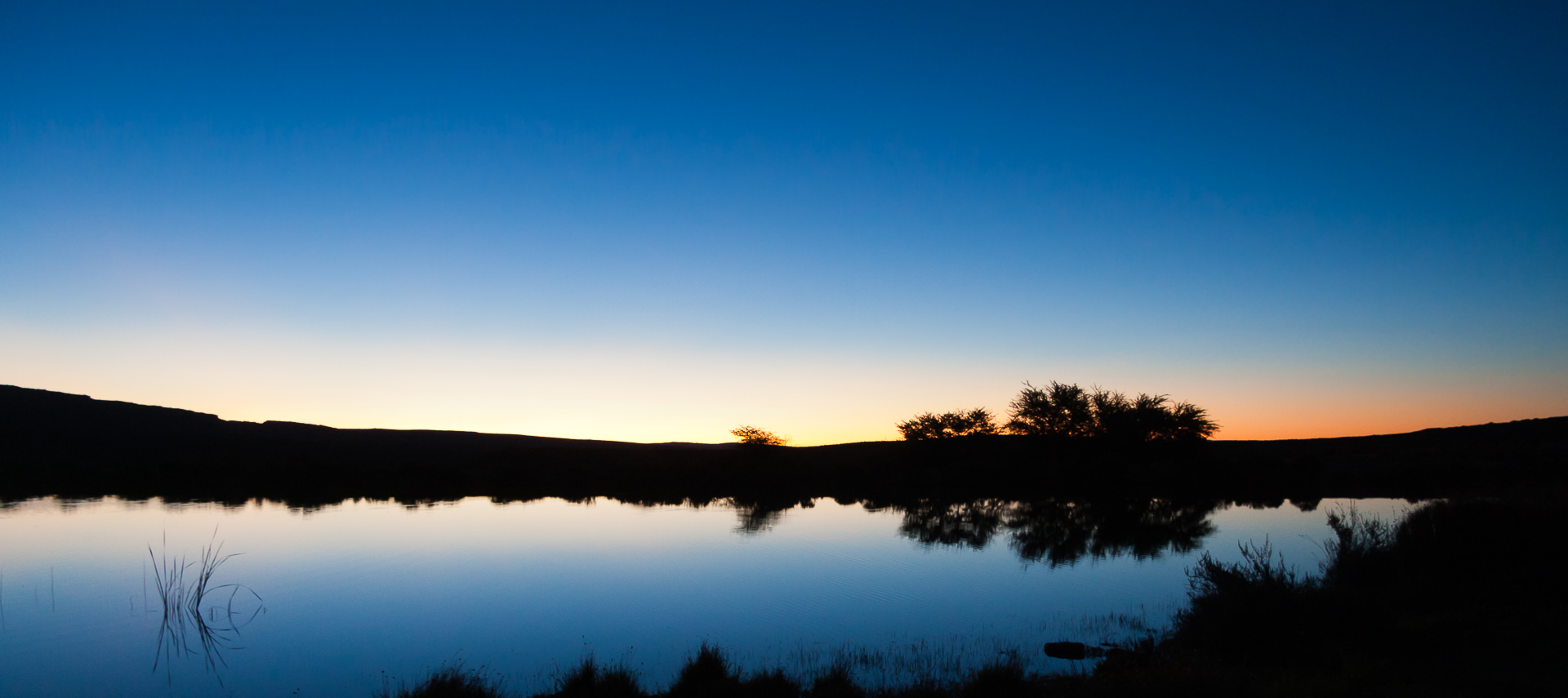 shooting silhouettes at sunset of a watering hole