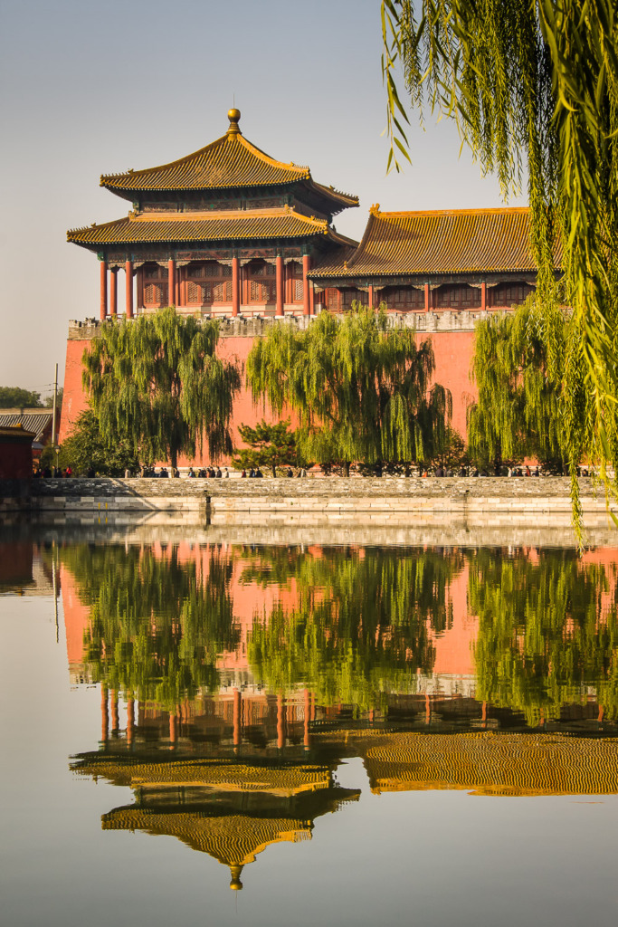 The Meridian or South Gate Watchtower of the Forbidden City in Beijing, China, with a reflection in the moat.