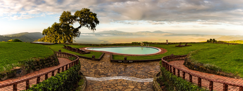 Why use manual mode? When shooting a series of photos to make into a panorama, it's important to have consistent exposure like in this panorama of a pool at the Sopa Lodge with the Ngorongoro Crater in the background in Tanzania.
