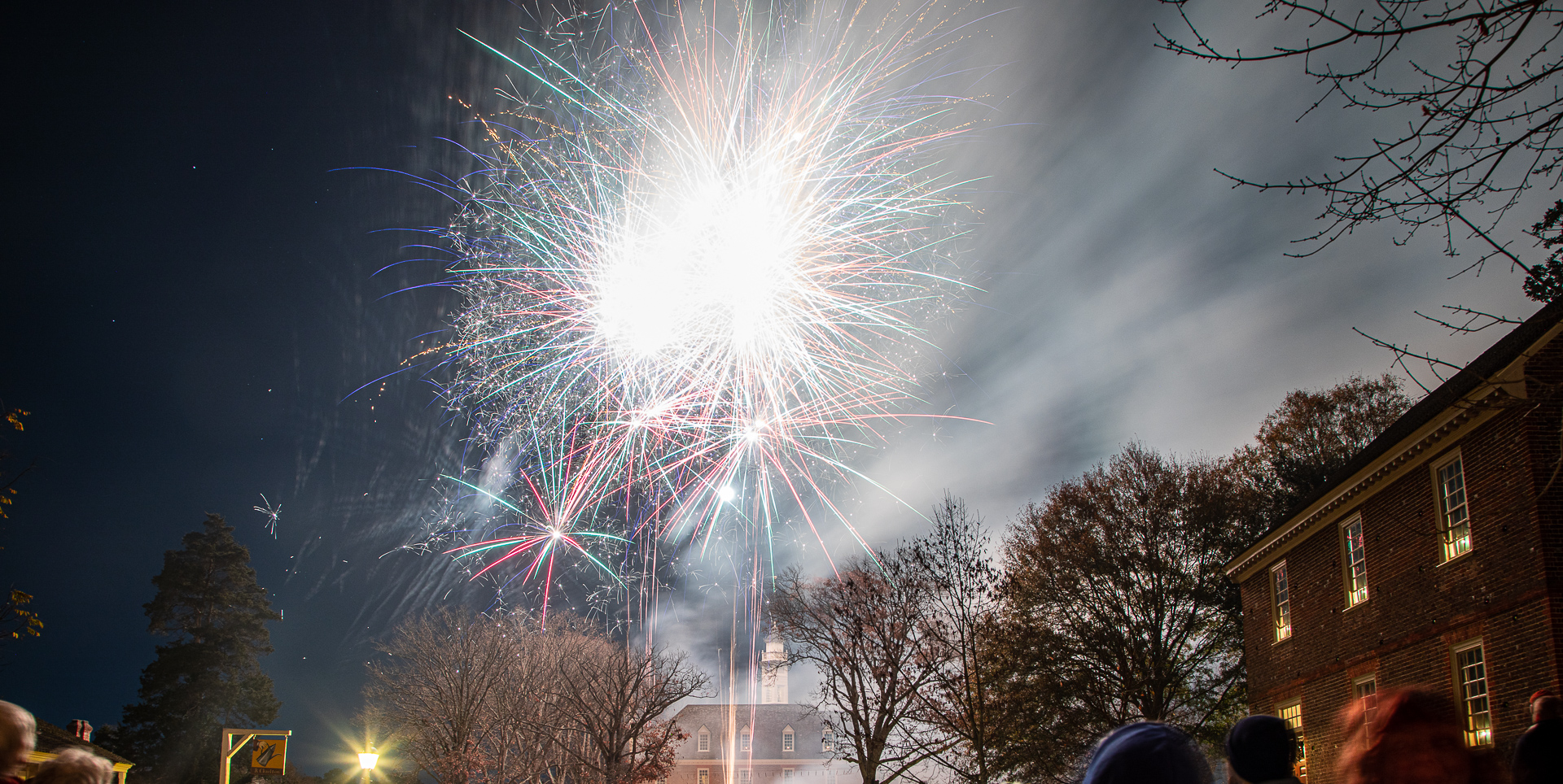 fireworks in the sky at the Grand Illumination in Colonial Williamsburg