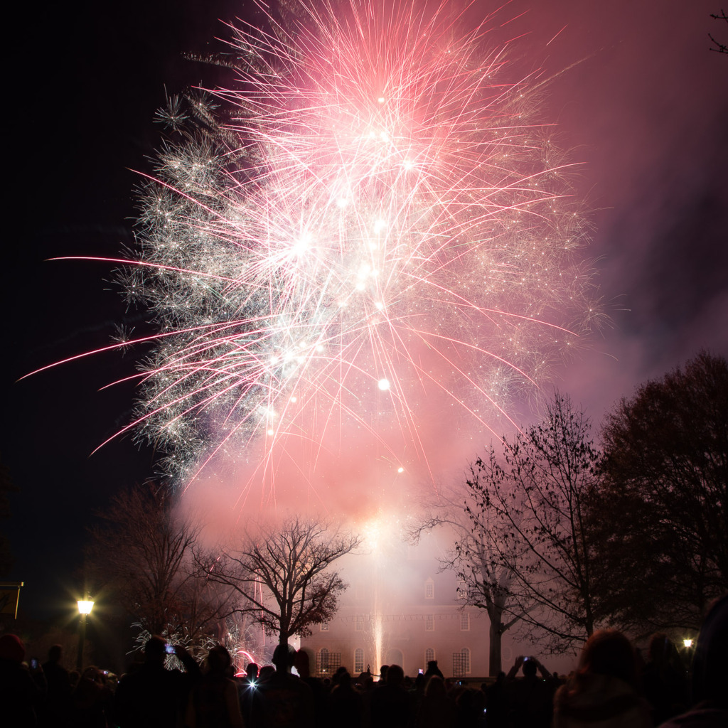 photograph fireworks using bulb mode to capture multiple volleys like these pink ones