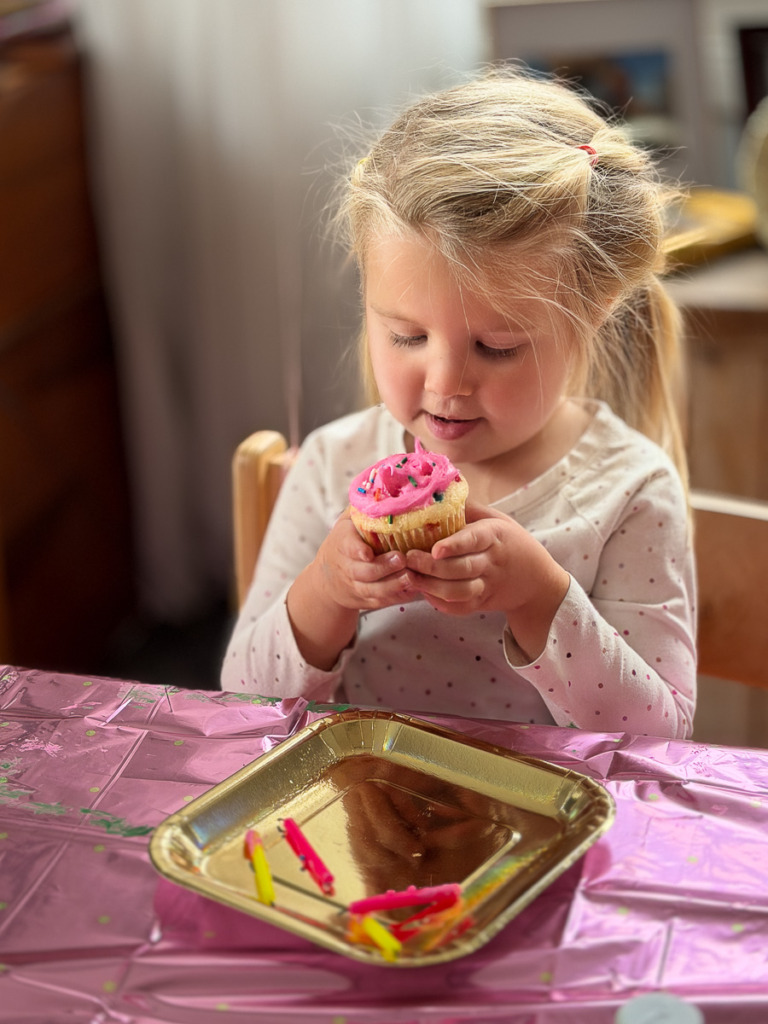 Young child with birthday cupcake