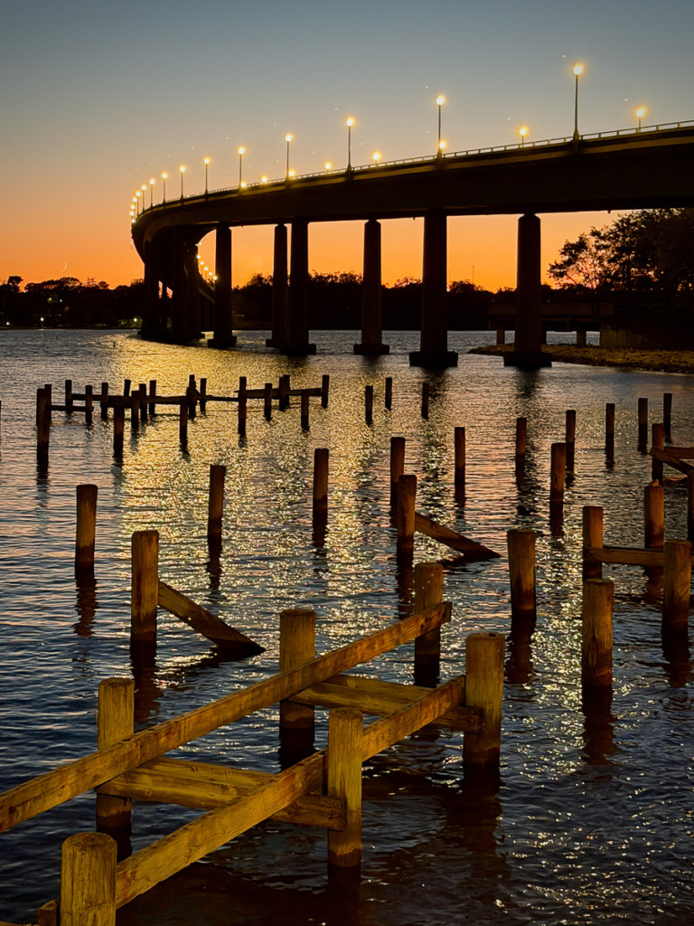 Sunset photo of the Naval Academy Bridge over the Severn River.